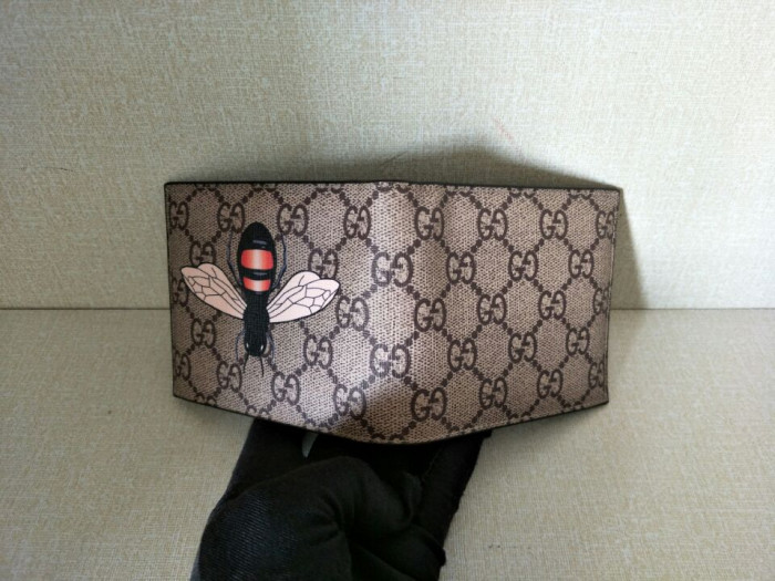 G*u*i with plaid bee wallets